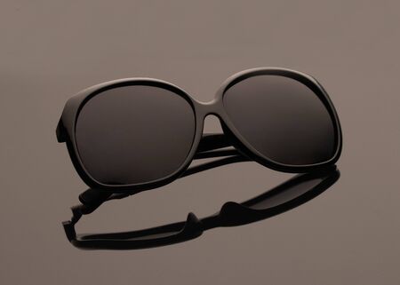 Sunglasses on the glass backgroundの写真素材