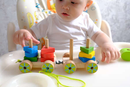 child boy playing with toys indoors at homeの写真素材