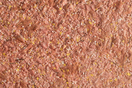 Abstract red texture of decorative plaster liquid wallpaper