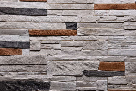 Stone grey orange wall texture background natural color.の写真素材