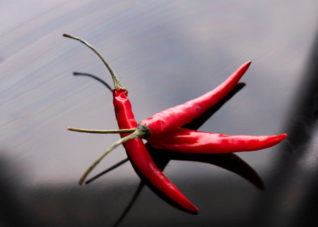 Red hot chili pepper on a black background. selective focus.の写真素材