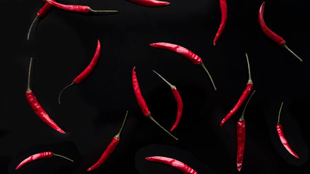 Red hot chili peppers on a black background. close-up.の写真素材