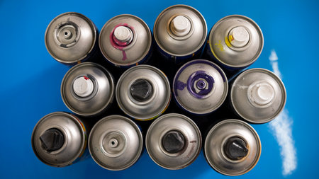 Aluminum cans of different sizes on a blue background close-upの写真素材
