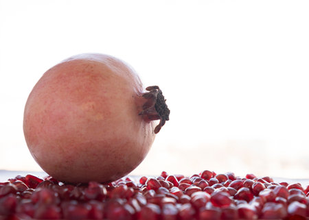 pomegranate seeds on a white background, close-upの写真素材