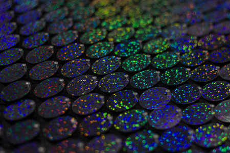 Close-up of a lot of colorful sequins. Shallow depth of field.の写真素材