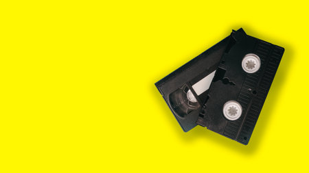 Video tape isolated on yellow background. top view. copyspace.の写真素材