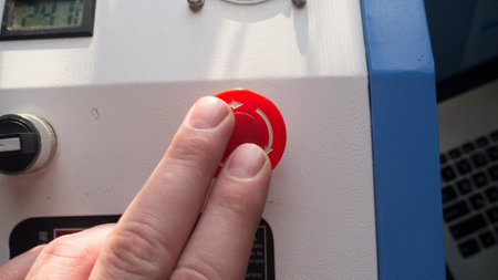 Close-up of a woman's hand pressing a button on the control panelの写真素材