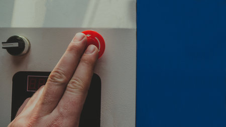 Close-up of a woman's hand pressing a button on the elevatorの写真素材