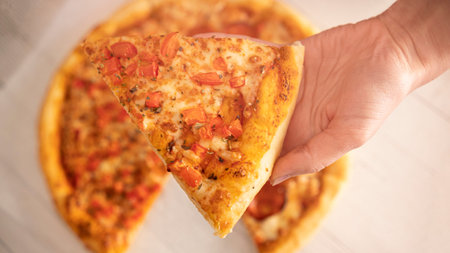 Pepperoni pizza on a white wooden table. close-up.の写真素材