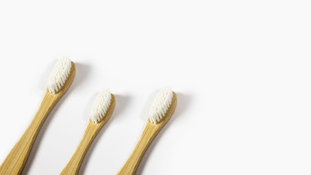 Three bamboo toothbrushes isolated on white background with copy space.の写真素材