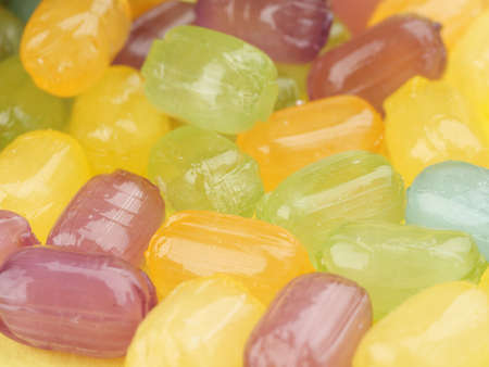 Lots of multi-colored caramel sweets close-up.の写真素材