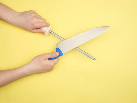 The man rules the big chef's knife about the musat.の写真素材