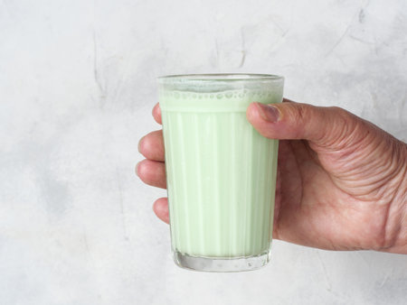 Traditional Indian drink Bhang Lassi in hand.