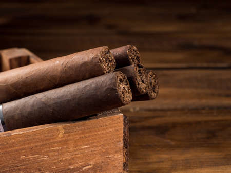 Cigars and whiskey on a wooden table. copyspace.の写真素材
