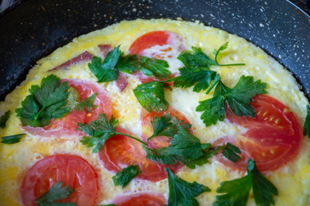 Do-it-yourself omelette with tomatoes and herbsの写真素材