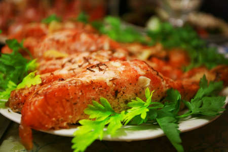 baked fish in a plate with vegetable.の写真素材