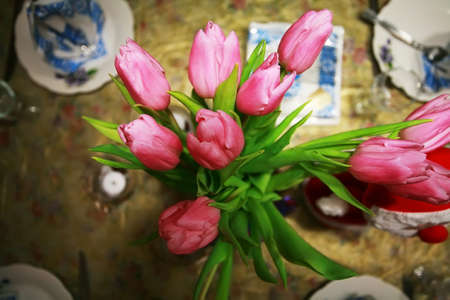 bunch of tulips stay on a table.の写真素材