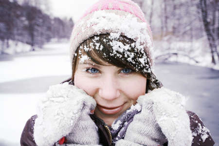 beautiful girl with a blue eyes in the  winter forerst の写真素材