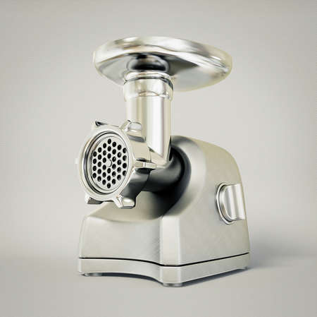 electric meat grinder isolated on a gray.の写真素材