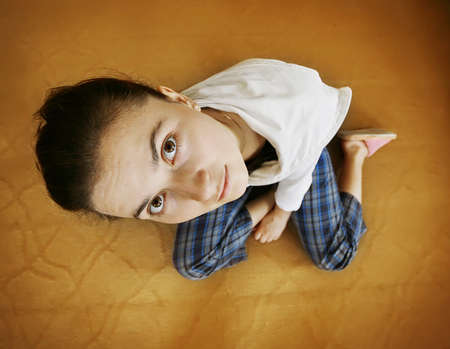 Girl was photographed from above fisheye on isolated background.の写真素材