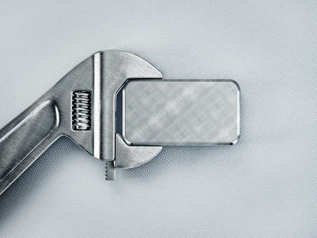 steel board and metal wrench isolated on a light backgroundの写真素材