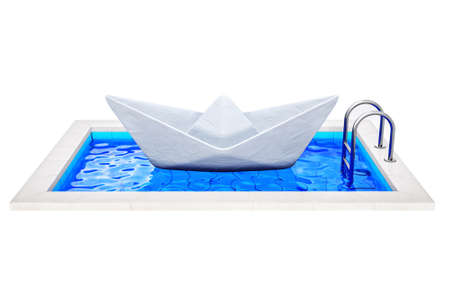 papper ship in a swimming pool isolatedの写真素材