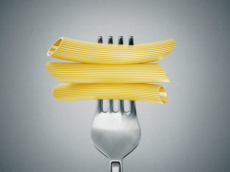 tube pasta on the fork isolated  grey
