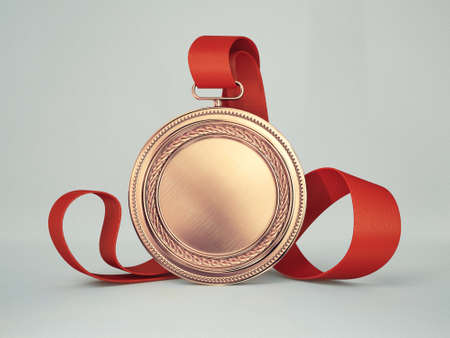gold medal isolated on a grey backgroundの写真素材