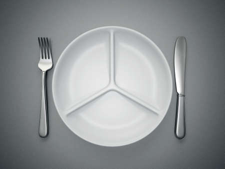 plate fork and knife isolated on a grey backgroundの写真素材