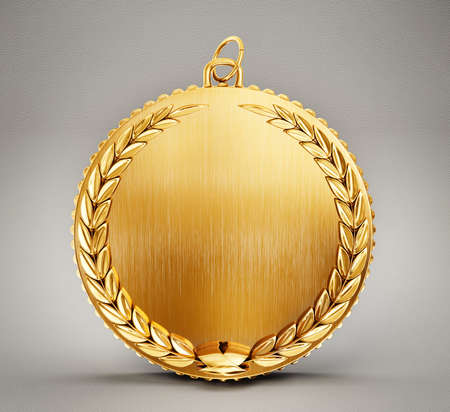 gold medal isolated on a grey backgroundの写真素材