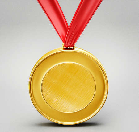 gold medal isolated on a grey backgroundの写真素材