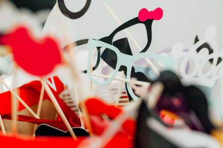 photo booth props for wedding. funny paper faces, lips, glasses and mustacheの写真素材
