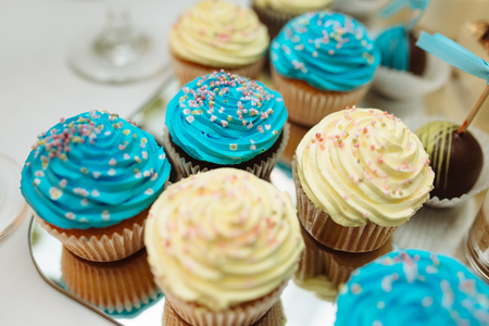 Candy Bar decorated by Delicious sweet buffet with cupcakes and other dessertscandies,happy birthday conceptの写真素材