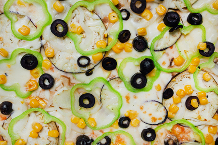 texture, Pizza with mushrooms black olives onions green pepper, black background with flour, sliced peppers, Top view. Banner, close-up, copy spaceの写真素材