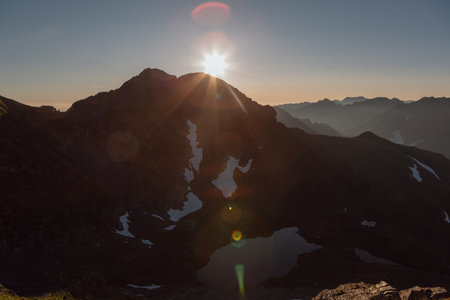 sunrise, in view of the capra lake, View from peak of buteanu Peak 2507m  mountain landscape in the...