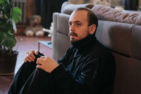 stressed and sad caucasian bearded man,の写真素材