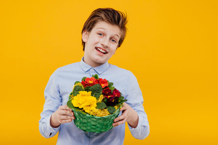 happy boy with basket of flowers in his hand