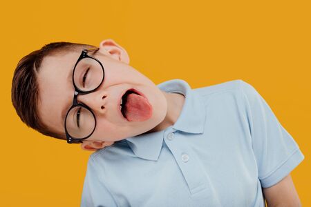 little boy portrait with glasses with tongue outの写真素材