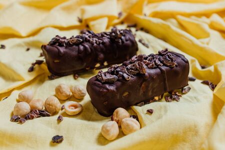 vegetarian chocolate on yellow background, top view, vegetarian sweetsの写真素材