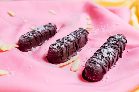 vegetarian chocolate on pink background, top view, vegetarian sweetsの写真素材