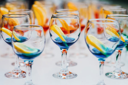 Glass cocktail glasses on the table served for the reception in the restaurantの写真素材