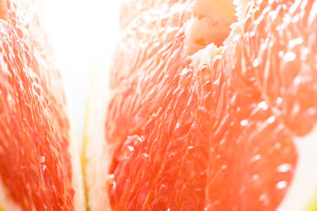 grapefruit texture background. macro of red grapefruit. red grapefruit center texture macro background. Close-up. The Concept Of Healthy Eating.の写真素材