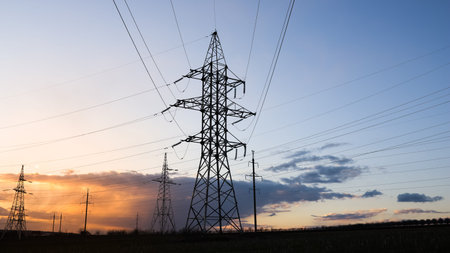 industrial landscape of towers with high voltage cables. High Tension Cables. High voltage electric...