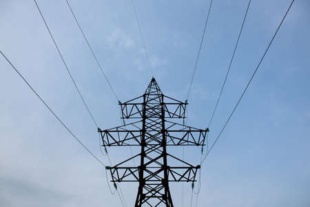 High voltage electric pole and transmission lines in the evening. energy industry, energy savingの写真素材
