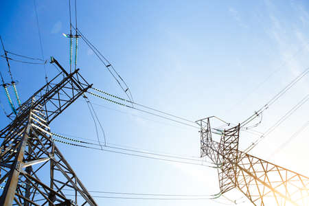 Electricity: High voltage power lines, Sunrise with pylons in Silhouette and Colorful Skyの写真素材