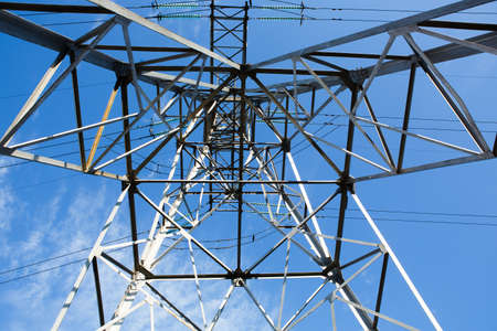 high voltage power lines at sunset, high voltage electric transmission tower. energy industry, energy savingの写真素材