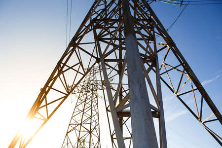 industrial landscape. Silhouette High voltage electric tower on sunset time and sky on sunset time background.の写真素材