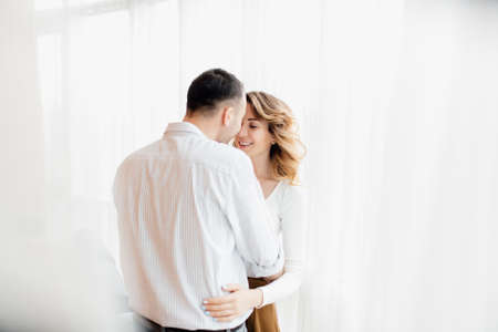 Loving everything about her. Beautiful young couple bonding and smiling. cheerful excited glad careless happy with toothy beaming smile brunette attractive woman and with stylish man,の写真素材