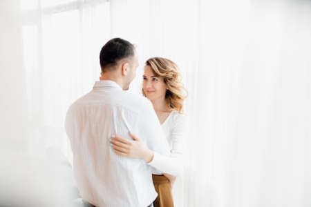 Loving everything about her. Beautiful young couple bonding and smiling. cheerful excited glad careless happy with toothy beaming smile brunette attractive woman and with stylish man,の写真素材