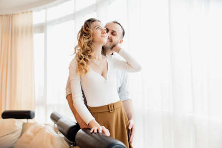 Loving everything about her. Beautiful young couple bonding and smiling. cheerful excited glad careless happy with toothy beaming smile brunette attractive woman and with stylish man,の写真素材